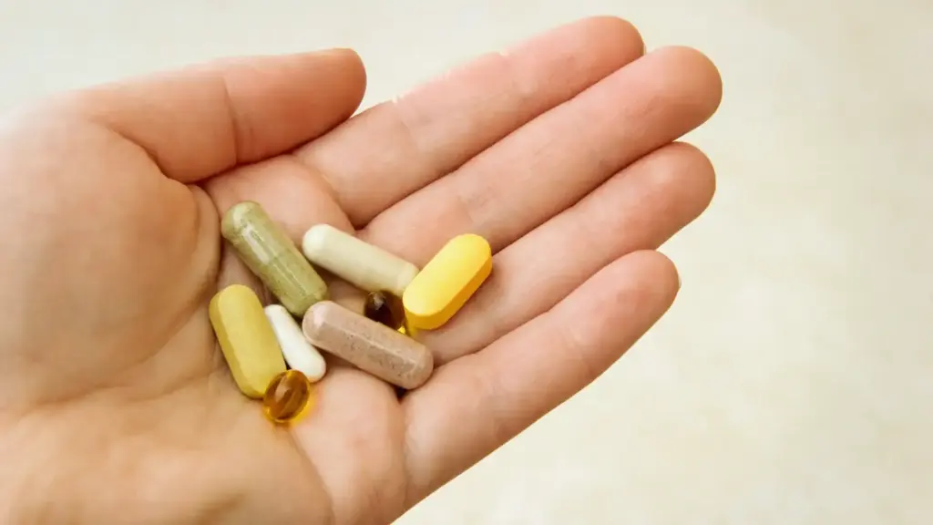 a hand full of vitamins