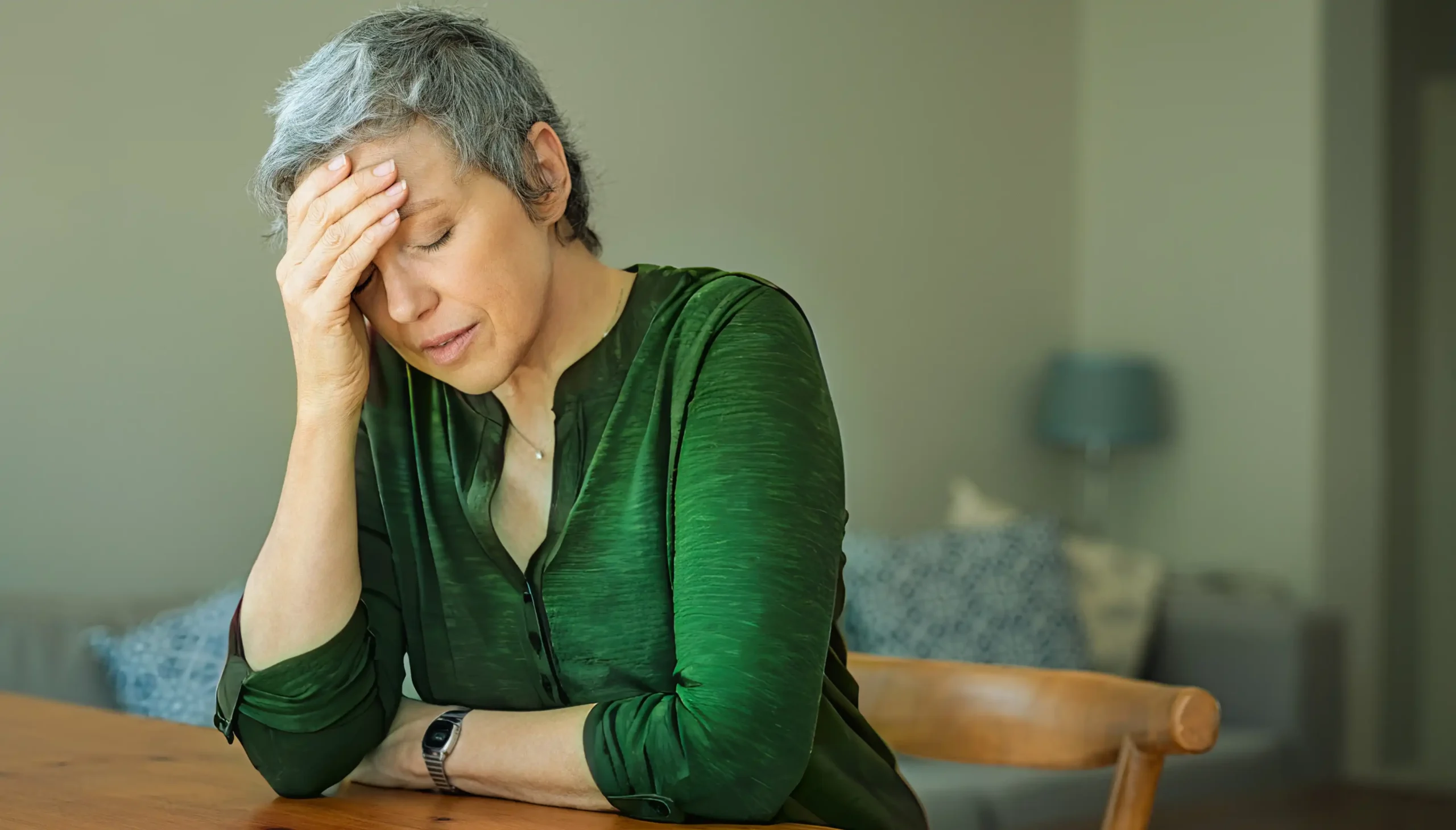 middle aged tired woman leaning on the hand