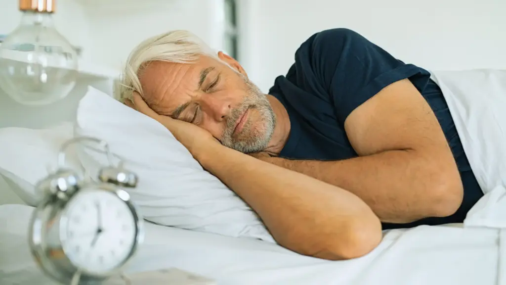 middle aged man taking a nap