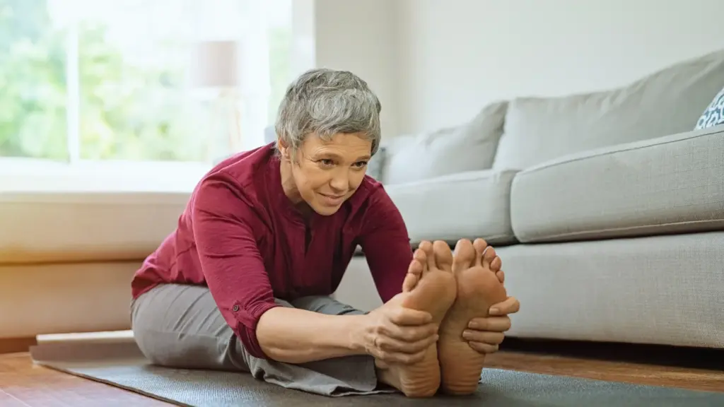 elderly woman practicing yoga